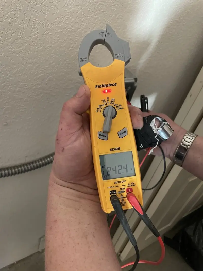 Voltage testing with clamp meter during Electrical Installation Services in Downey
